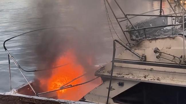 The boat was engulfed by the time it was reeled in for firefighters to battle the blaze. Picture: Greg Manning