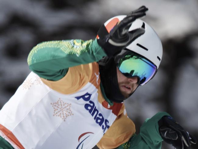 Simon Patmore of Australia competes during the men's snowboard cross run at the Jeongseon Alpine Center at the Pyeongchang 2018 Paralympic Winter Games in Pyeongchang, South Korea, Monday, March 12, 2018. (Simon Bruty/OIS/IOC via AP)