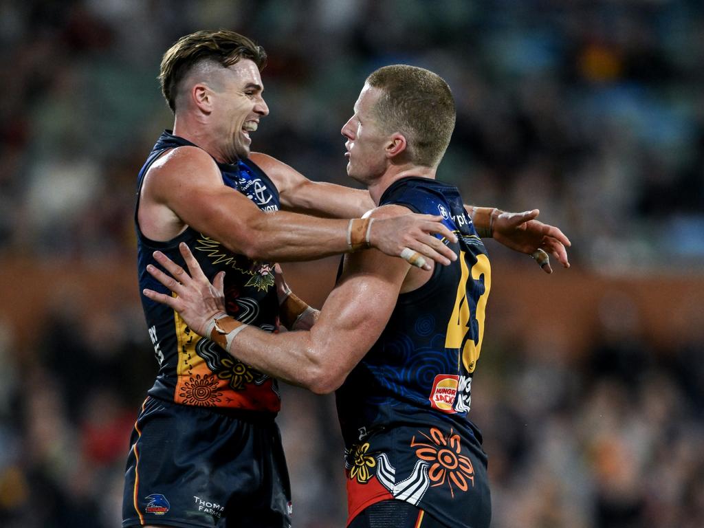 ADELAIDE, AUSTRALIA – MAY 26: Reilly O'Brien of the Crows celebrates a goal with Ben Keays of the Crows during the round 11 AFL match between Kuwarna (the Adelaide Crows) and Waalitj Marawar (the West Coast Eagles) at Adelaide Oval, on May 26, 2024, in Adelaide, Australia. (Photo by Mark Brake/Getty Images)