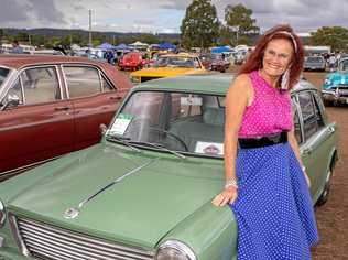 REUNION: Trisha Thompson met an old friend at the CHrome and Clutter Retro festival on the weekend - the first car she ever owned, a 1965 Morris 1100. Picture: Dominic Elsome