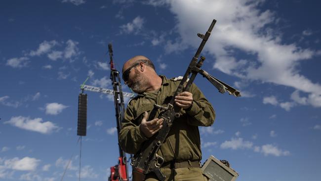 An Israeli soldier carries a weapon near the border with the Gaza Strip on January 21, 2024 in Southern Israel, Israel. Picture: Amir Levy/Getty Images