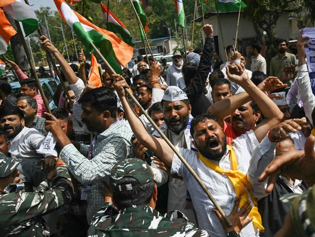 Aam Aadmi Party (AAP) activists shout slogans during a protest near India's Prime Minister Narendra Modi residence in New Delhi on March 26, 2024, after AAP chief and Delhi Chief Minister Arvind Kejriwal arrest in connection with a long-running corruption probe. (Photo by Arun SANKAR / AFP)