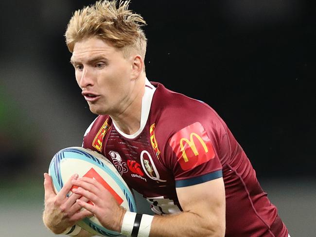 MELBOURNE, AUSTRALIA - MARCH 25: Tate McDermott of the Reds runs with the ball during the round five Super Rugby Pacific match between Melbourne Rebels and Queensland Reds at AAMI Park, on March 25, 2023, in Melbourne, Australia. (Photo by Kelly Defina/Getty Images)