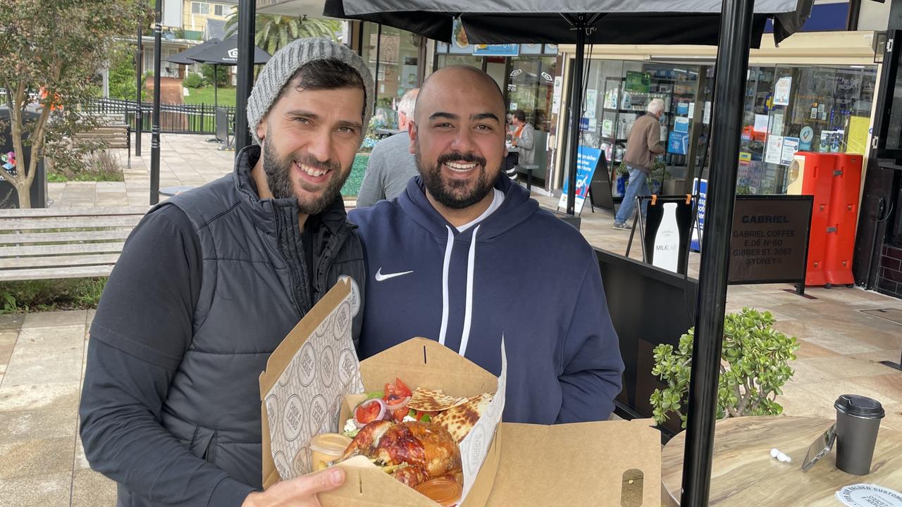 Chook A Licious co-owner Theo Asarlogou with loyal customer Stephen Samson.