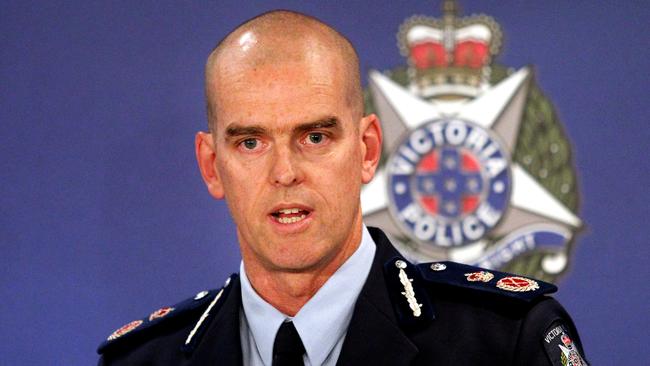 Victoria Police Chief Commissioner Simon Overland announces his resignation during a press conference in Melbourne.