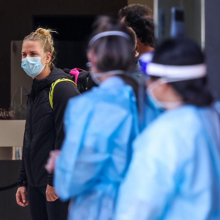 Australian Open tennis players and officials wait to board buses at the Pullman Melbourne Albert Park Hotel. Picture: NCA NewsWire