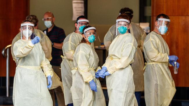 Medical staff suit up. Picture: Matt Turner.