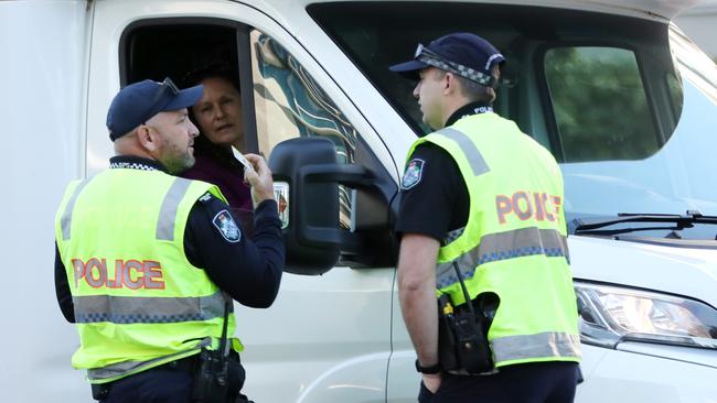 Police checking people at the Queensland border.Picture: NIGEL HALLETT