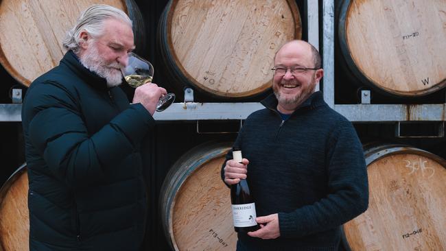 Oakridge Wines’ chief winemaker David Bicknell, left, and senior viticulturist Steve Faulkner with their wine of the year. Picture: Nadir Kinani