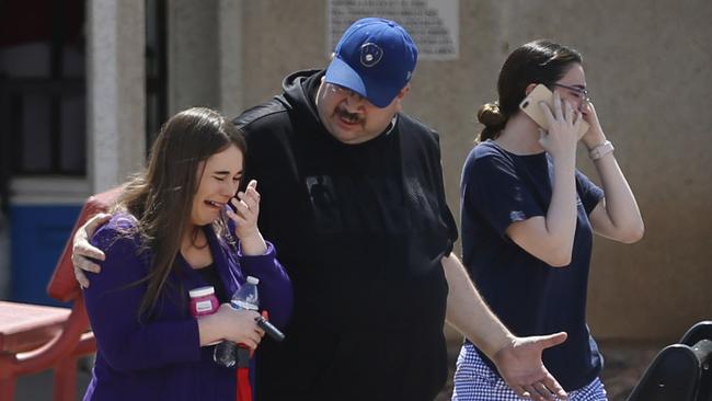 People looking for family and friends during the aftermath of a shooting at the Walmart, El Paso. Picture: AP