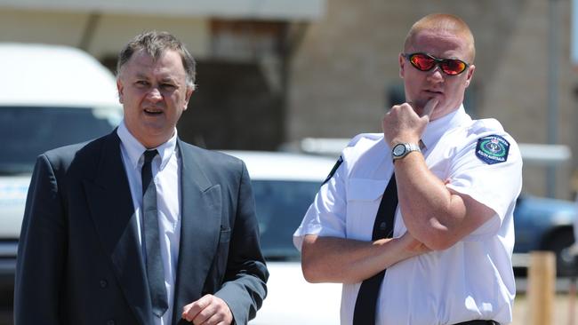 Garry Newman with a Sheriff’s Officer during his trial. Picture: Alice Prokopec