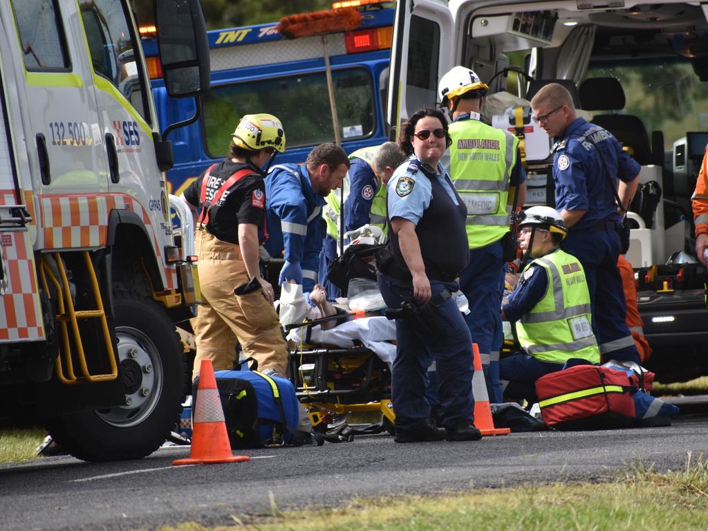 Multiple emergency services crews attended and after-school traffic was blocked after a red sedan Mitsubishi Lancer sedan crashed into a power pole on Rogans Bridge Rd north of Waterview Heights on Thursday, 18th February, 2021. Photo Bill North / The Daily Examiner