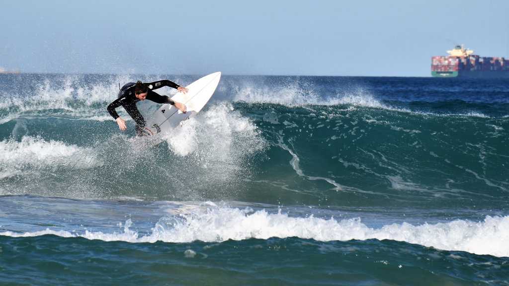 Surfers and bodyboard riders making the most of the waves at Kawana on the weekend. Picture: Mark Furler