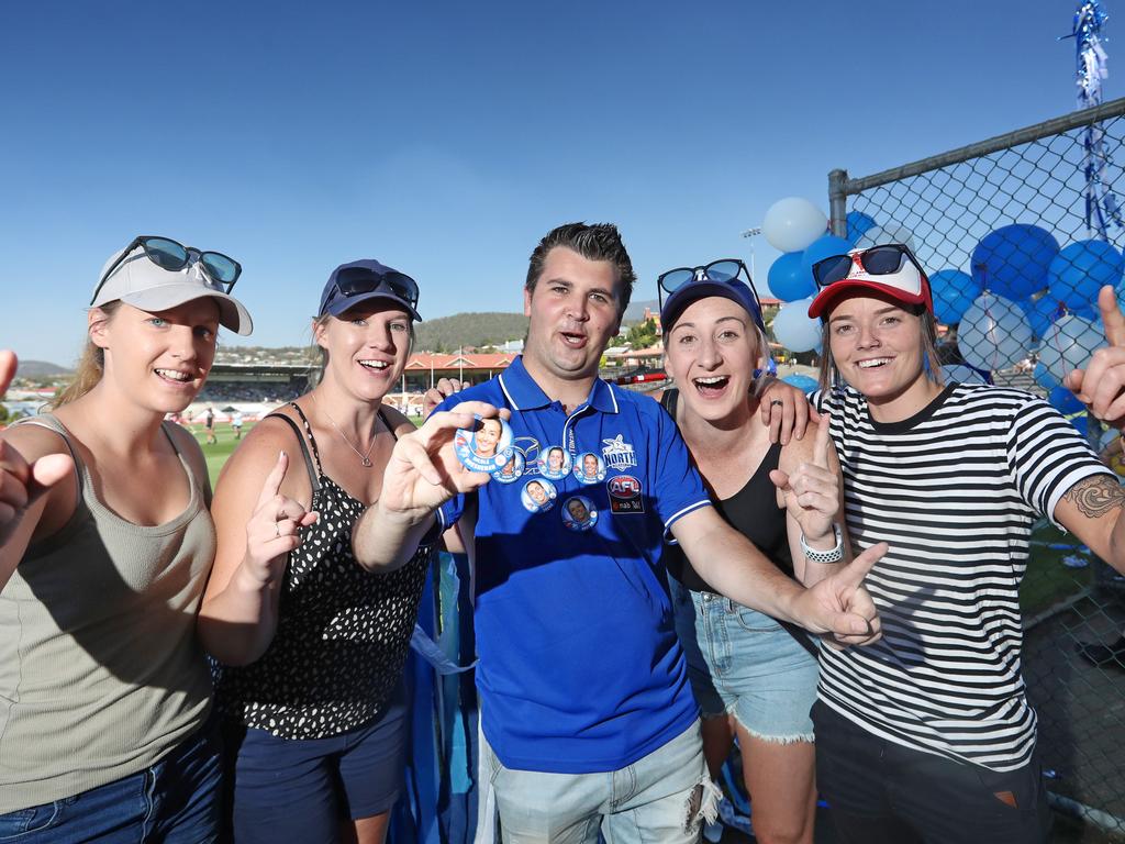 North Melbourne fan Sam Breen, centre, with Tasmanian North Melbourne player Nicole Bresnehan’s former Clarence Football Club teammates, from left, Sophie and Courtney Pennicott, Zoie Crawford and Tarn Ford. Picture: LUKE BOWDEN