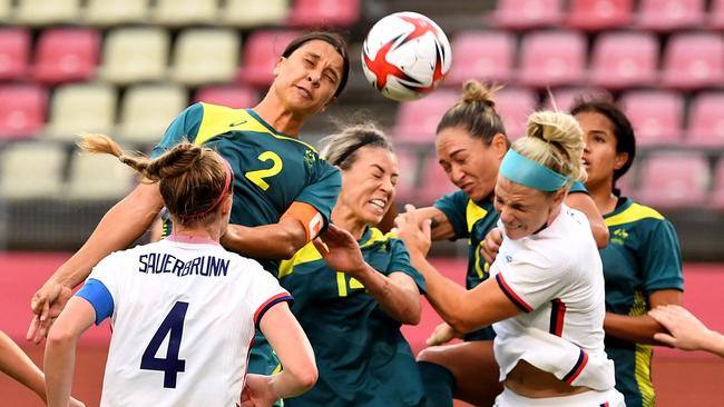 Australia's forward Sam Kerr (2nd L) heads for a shoot during the Tokyo 2020 Olympic Games women's group G first round football match between USA and Australia at the Ibaraki Kashima Stadium in Kashima city, Ibaraki prefecture on July 27, 2021. (Photo by SHINJI AKAGI / AFP)