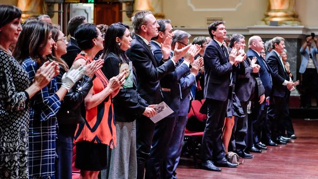 Guests give a standing ovation at Quentin Kenihan’s memorial service. Picture: AAP / Morgan Sette