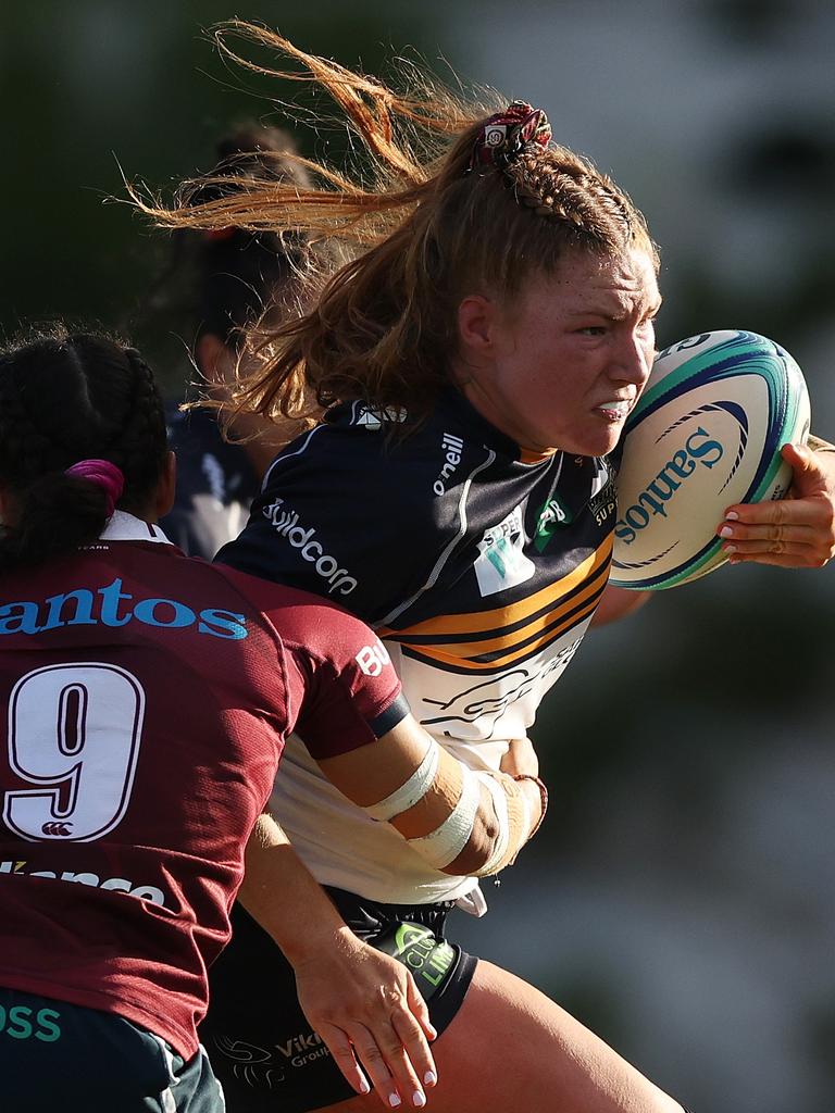 Grace Kemp tries to bust through a tackle for the Brumbies.