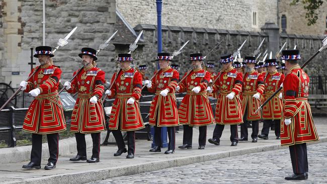 Yeomen Warders outside The Tower of London ahead of a 96 round gun salute at the Tower of London.