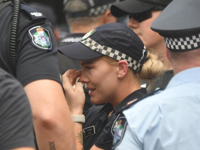 Memorial police service for Constable Matthew Arnold and Constable Rachel McCrow at Townsville Police Station. Constable Bree Lochyear, who went through police academy with Rachel wipes away tears. Picture: Evan Morgan