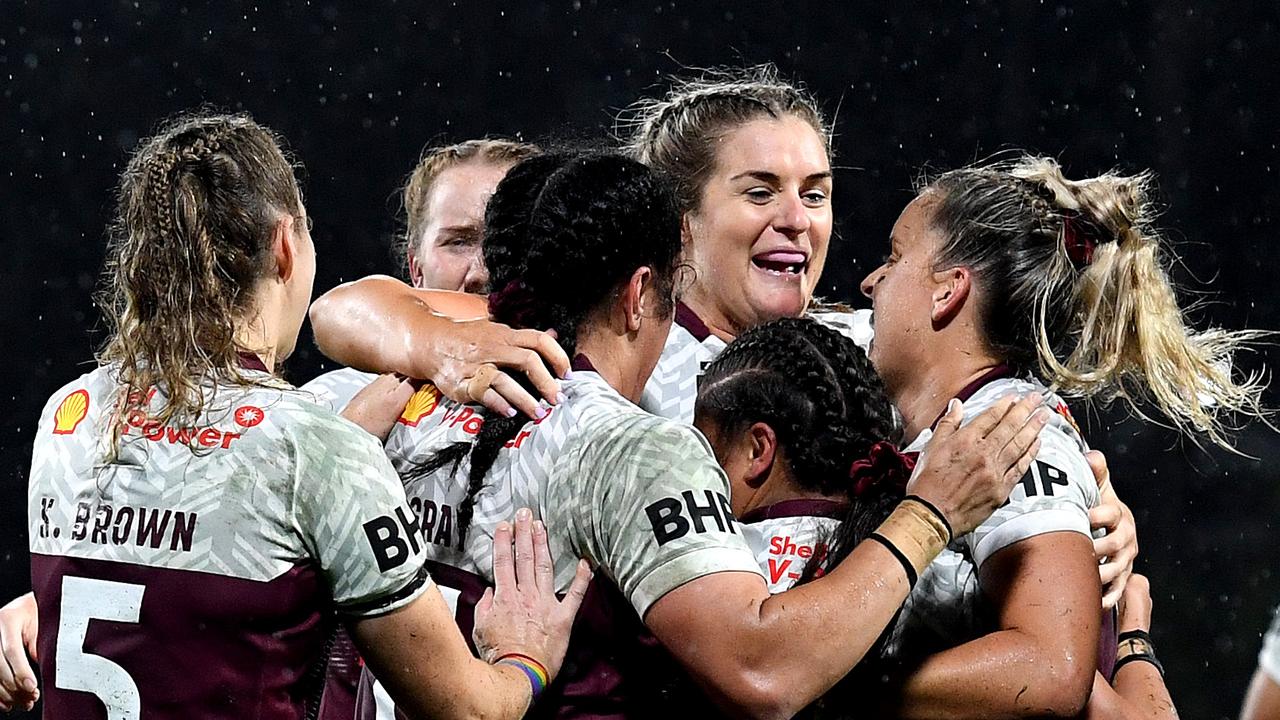 SUNSHINE COAST, AUSTRALIA - JUNE 25: Destiny Brill of Queensland is congratulated by team mates after scoring a try during the Women's Rugby League State of Origin match at the Sunshine Coast Stadium on June 25, 2021 in Sunshine Coast, Australia. (Photo by Bradley Kanaris/Getty Images)