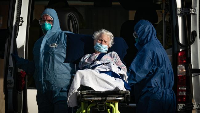 A frail resident being removed from the St Basils nursing home in Melbourne’s north after the facility was overwhelmed with coronavirus cases speaks to the scale of the disaster in aged care. Picture: Jason Edwards