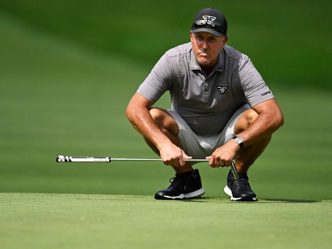 (FILES) Phil Mickelson of the United States line up a putt on the 11th green during day one of the LIV Golf Invitational - Greenbrier at The Old White Course on August 04, 2023 in White Sulphur Springs, West Virginia. Phil Mickelson has placed bets worth a total of more than $1 billion during his career, including a $400,000 wager on the outcome of the 2012 Ryder Cup, according to excerpts from a forthcoming book published in US media on August 10, 2023. (Photo by Eakin Howard / GETTY IMAGES NORTH AMERICA / AFP)