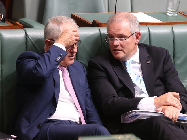 PM Malcolm Turnbull and Treasurer Scott Morrison during a division in Question Time in the House of Representatives Chamber, Parliament House in Canberra. Picture Kym Smith