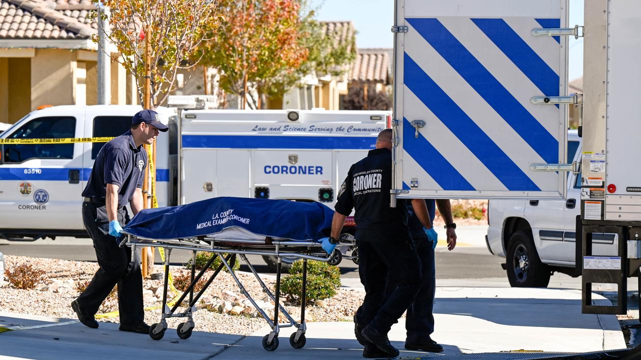 Los Angeles County Coroner officials remove a body from a home where five bodies were found dead. Picture: David Crane/MediaNews Group/Los Angeles Daily News/Getty Images