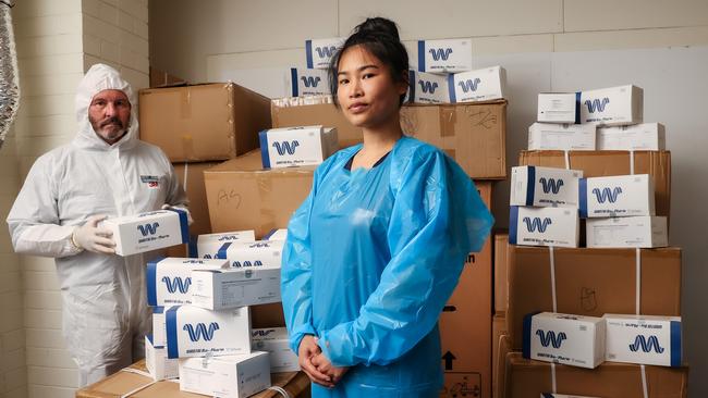 Suretest medical director Peter Lewis and registered nurse On Hongsopha in Melbourne on Wednesday with rapid antigen tests. Picture: Ian Currie