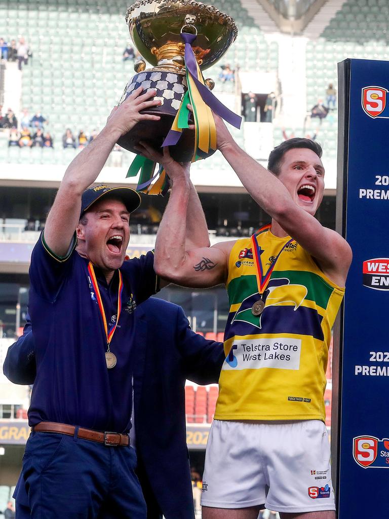 Jade Sheedy (left) celebrates Woodville-West Torrens’ 2021 SANFL grand final triumph with captain Luke Thompson. Picture: Sarah Reed