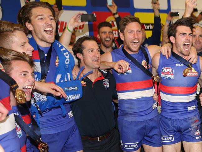2016 AFL Grand Final match between the Western Bulldogs and the Sydney Swans at the Melbourne Cricket Ground (MCG), Melbourne, Australia on October 1, 2016. Luke Beveridge sings the song with his Bulldogs players Picture :Wayne Ludbey
