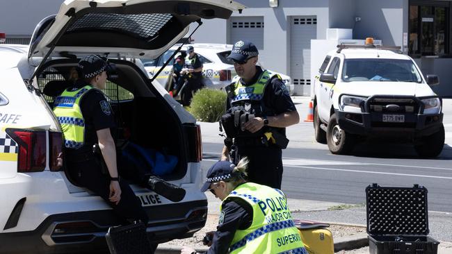 Crime Scene Investigators and Police at the scene after pedestrian was hit by a car outside a Ampol petrol station. Picture: Emma Brasier