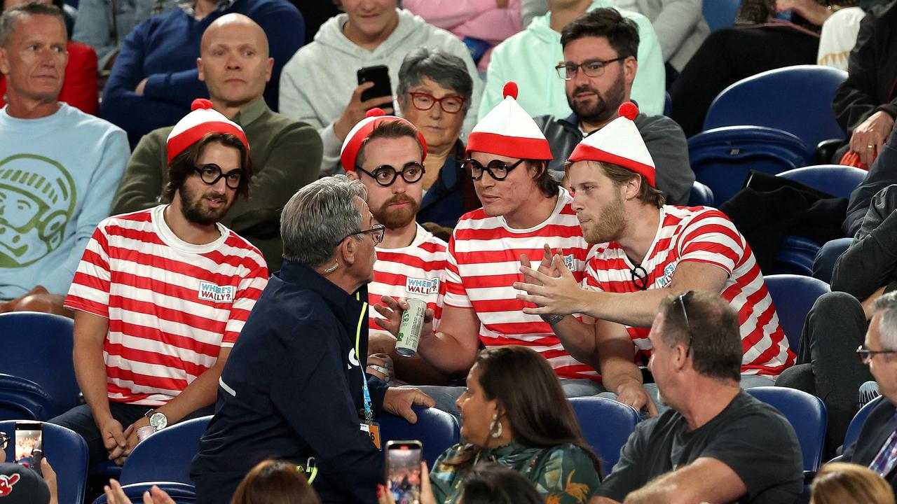 A security guard speaks to the fans. Picture: AFP Images