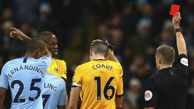 Wolves’ Willy Boly (left, rear) is sent off at the Etihad Stadium. Picture: AP
