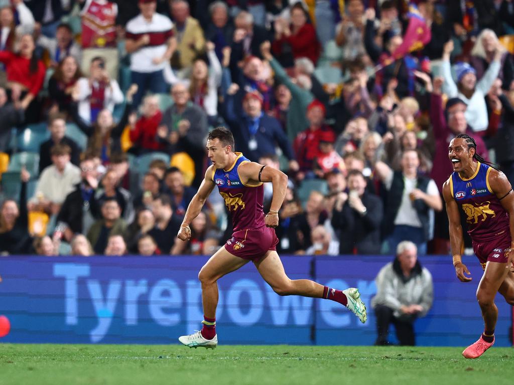 Hugh McCluggage wheels off in celebration after kicking the matchwinner. Picture: Chris Hyde/AFL Photos/via Getty Images