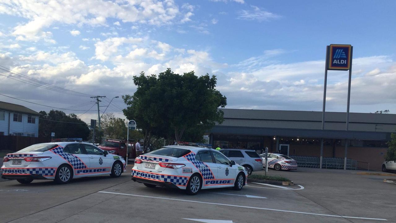 Police say a woman has been struck by an arrow in an Ipswich supermarket after a man was seen firing the projectiles as he walked down the street.