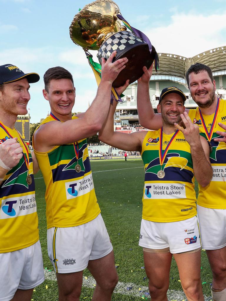 Woodville-West Torrens’ triple premiership winners, from left, Patrick Giuffreda, Luke Thompson, Jimmy Toumpas and Jarrad Redden, after the 2021 Grand Final win against Glenelg. Picture: Sarah Reed.