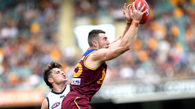 Daniel McStay of the Lions is challenged by Jake Kelly of the Crows at The Gabba on Saturday. Picture: Bradley Kanaris/Getty Images