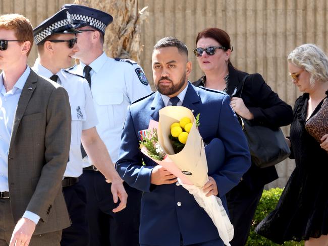 Mourners at the memorial service with full police honours for constables Rachel McCrow and Matthew Arnold at Brisbane Entertainment Centre. Picture: Steve Pohlner