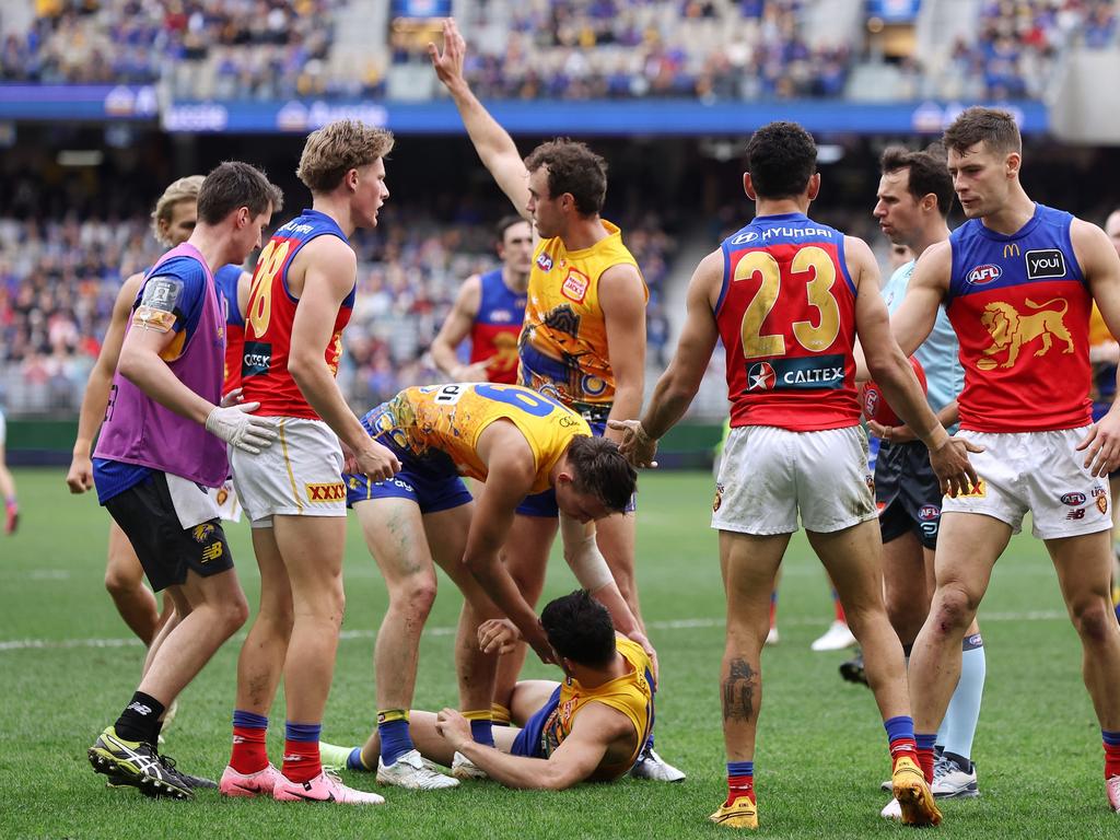 Liam Duggan is checked by teammates after being concussed in a tackle last round. Picture: Will Russell/AFL Photos via Getty Images