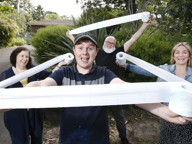 A person has been doing a random act of kindness and putting toilet rolls in letterboxes throughout Dickasons Rd in Heathmont. Ryan Purdie (centre), with neighbours (L) Jackie Hutson, Les Colston and Cate Martin who also received a single toilet roll.  Picture: David Caird