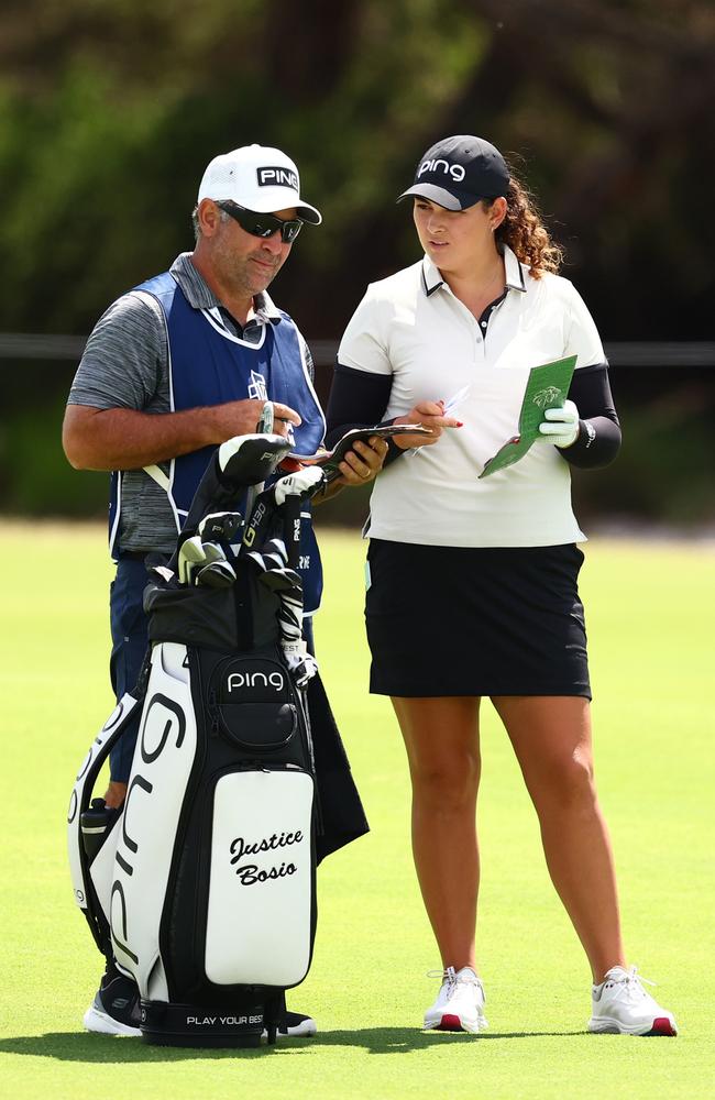 MELBOURNE, AUSTRALIA – DECEMBER 01: Justice Bosio of Australia alongside her caddie and father Luke Bosio prepares to play a shot on the second hole on day four of the ISPS Handa Australian Open 2024 at Kingston Heath Golf Club on December 01, 2024 in Melbourne, Australia. (Photo by Morgan Hancock/Getty Images)