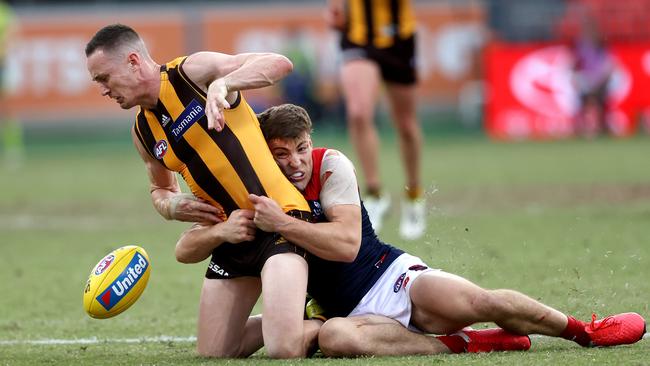 Jack Viney brings former Demon Tom Scully to his knees. Picture: Phil Hillyard.