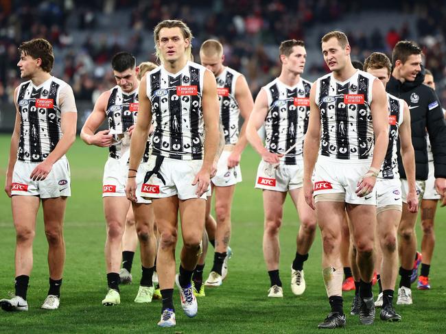 MELBOURNE, AUSTRALIA - JULY 05: Darcy Moore of the Magpies and his team mates look dejected after losing the round 17 AFL match between Collingwood Magpies and Essendon Bombers at Melbourne Cricket Ground, on July 05, 2024, in Melbourne, Australia. (Photo by Quinn Rooney/Getty Images)