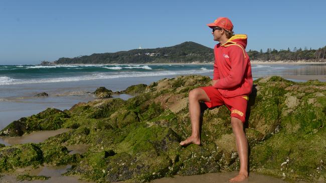 Lifeguard Finn Crisp assesses rock hazards at Main Beach in Byron Bay. Picture: Liana Boss