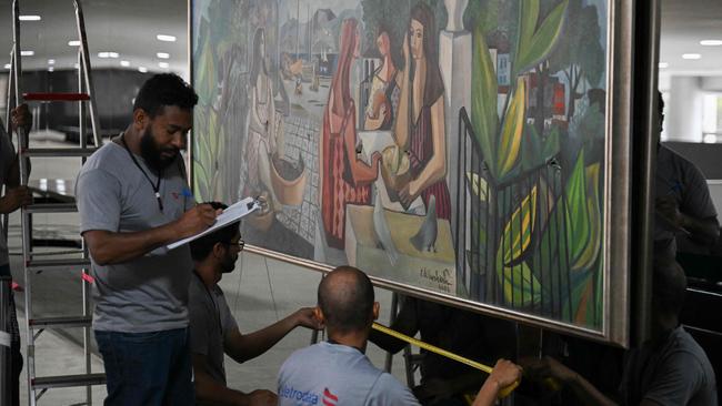 Workers inside the Planalto Palace in Brasilia on Monday. Picture: AFP