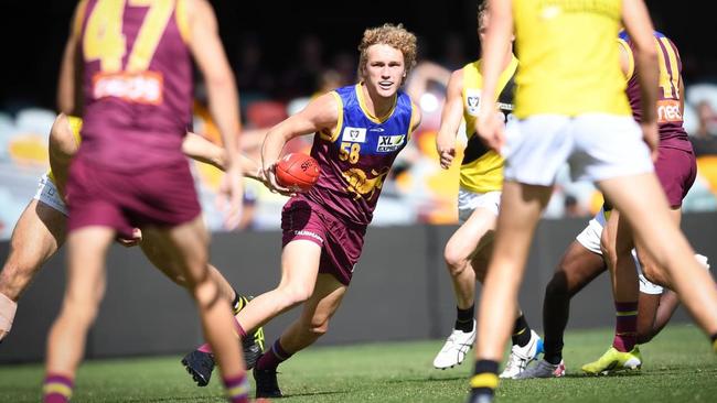 Charlie Bowes weaves between defenders as he makes a play for the Brisbane Lions in the VFL competition. Picture: High Flyer Images