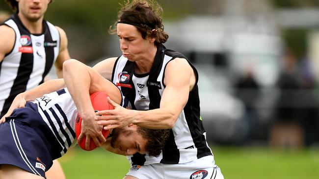 James Sekulovski is tackled by Marcus Lentini. Picture: Josh Chadwick