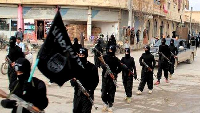 Fighters from the al-Qaida linked Islamic State of Iraq and the Levant (ISIL) marching in Raqqa, Syria. Picture: AP