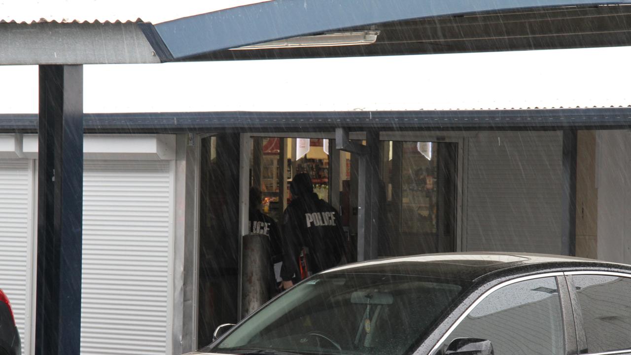 Police enter Coles in Alice Springs. Picture: Gera Kazakov